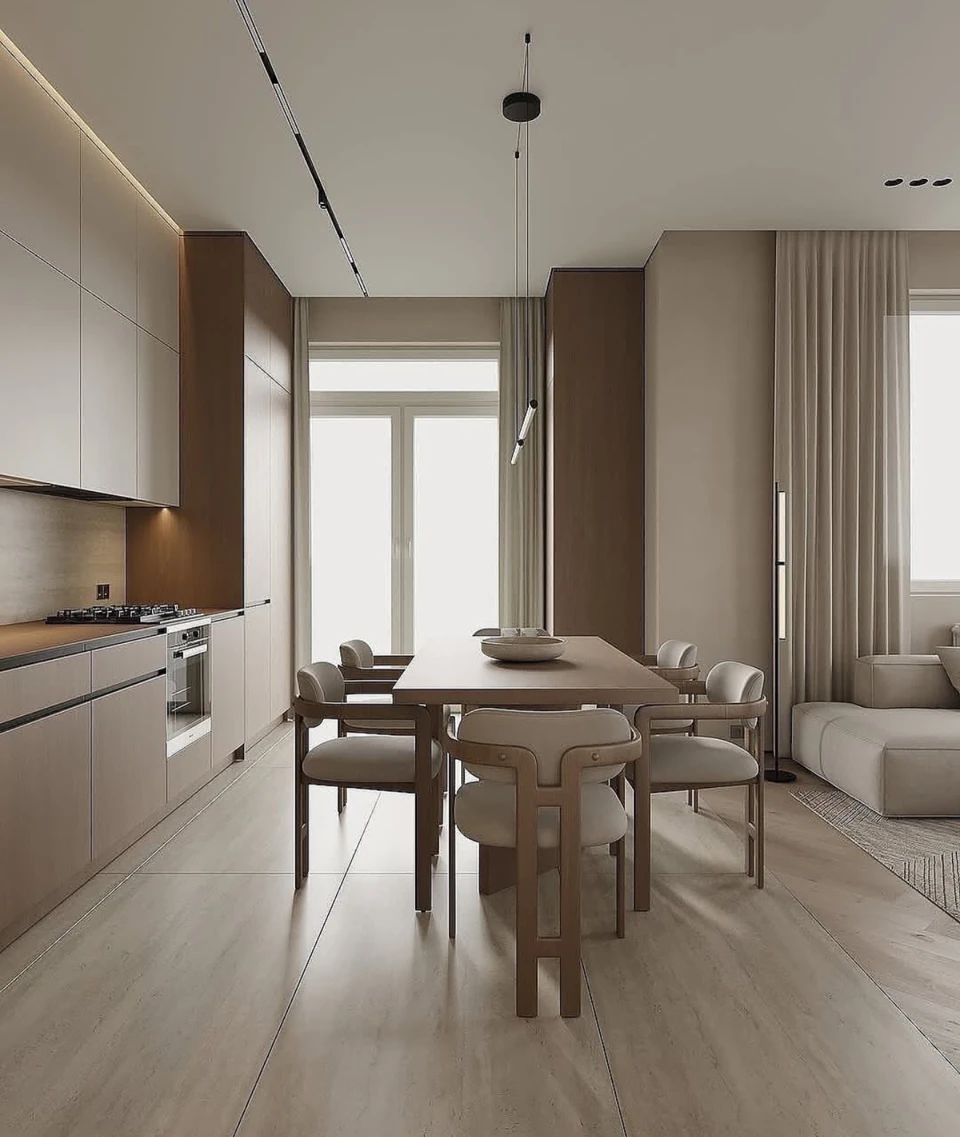 A view along the kitchen toward the dining area, lounge and window.