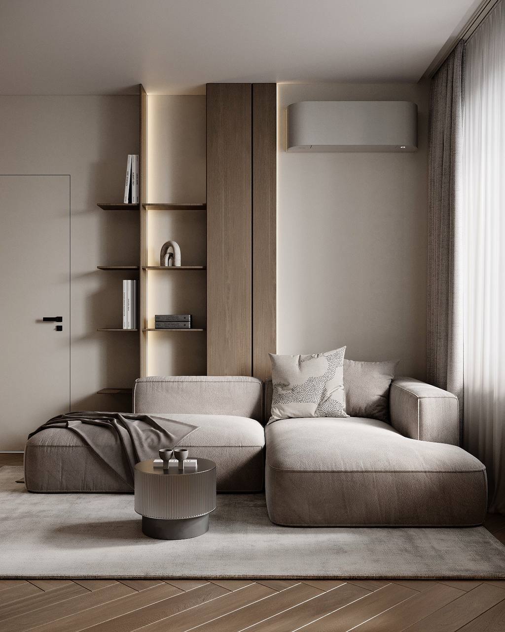 Soft neutral seating, a compact side table and integrated shelving with warm accent light.