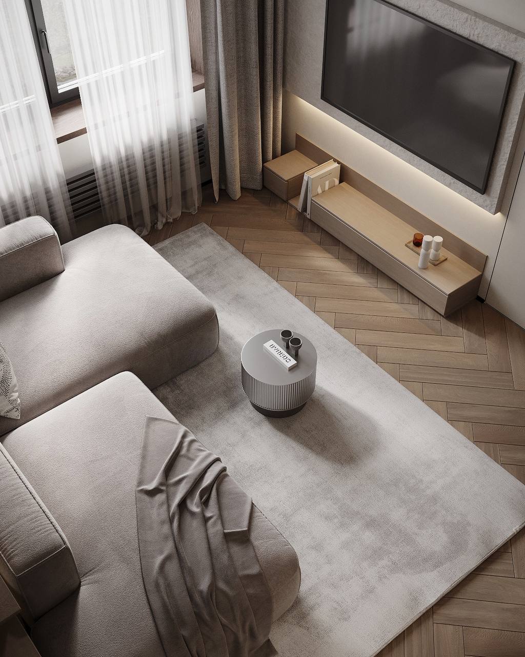 An overhead view of the lounge, low storage, a neutral rug and the repeated floor pattern.