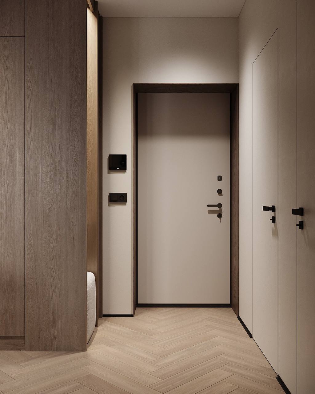 A simple entrance composition with muted wall finishes, wood-toned framing and dark door hardware.